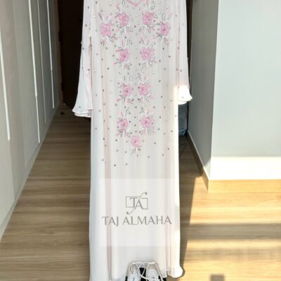 Elegant white dress with pink floral embroidery and gemstone accents, perfect for traditional or special occasions.