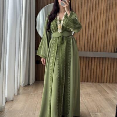 Elegant green traditional dress with intricate embroidery for women.