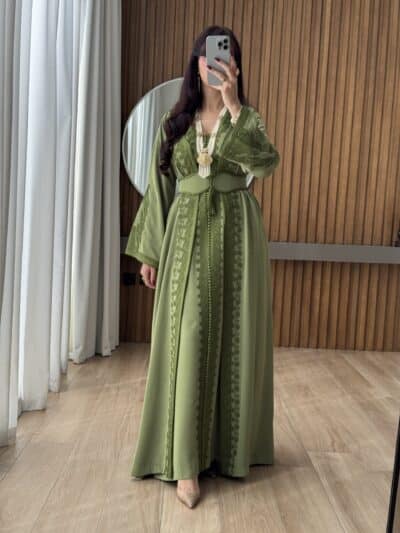 Elegant green traditional dress with intricate embroidery for women.