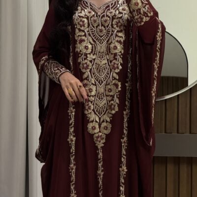 Elegant maroon traditional dress with intricate gold embroidery for special occasions.