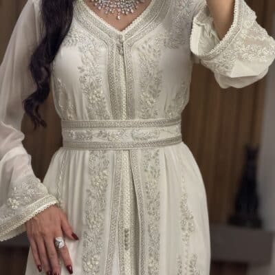 Elegant white embroidered wedding dress with intricate silver details, perfect for special occasions.