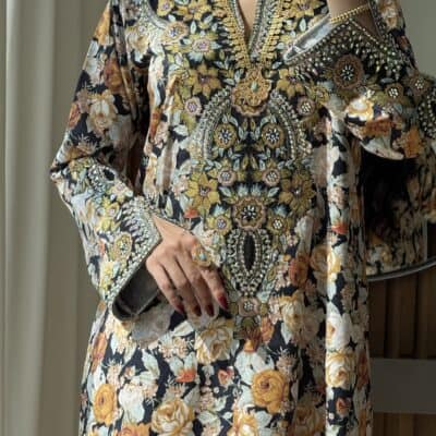 Elegant embroidered floral dress showcasing intricate gold and silver embellishments, perfect for special occasions.