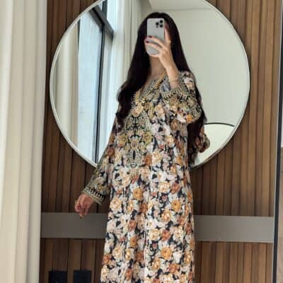 Elegant floral embroidered abaya with intricate details, perfect for fashionable modest wear at Taj Al Maha.