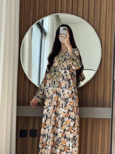 Elegant floral embroidered abaya with intricate details, perfect for fashionable modest wear at Taj Al Maha.