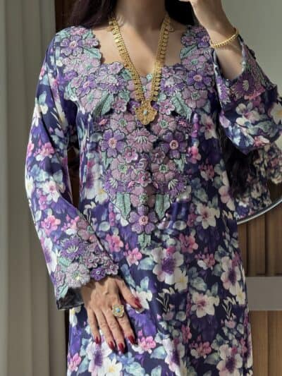 Luxurious floral embroidered dress with intricate beadwork and vibrant colors for elegant occasions.