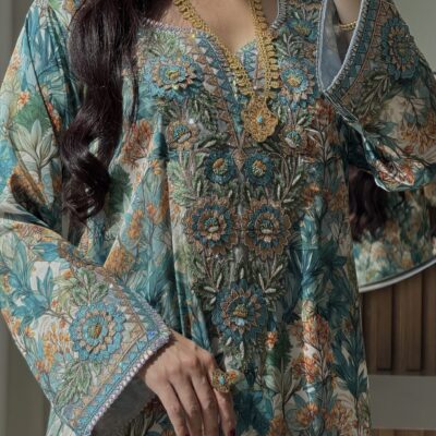 Intricate floral embroidered traditional dress with gold jewelry from Taj Almaha, showcasing cultural fashion sophistication.