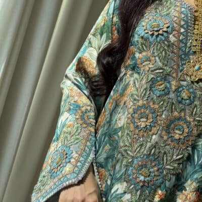 Elegant embroidered floral traditional dress showcasing intricate beadwork and vibrant colors.