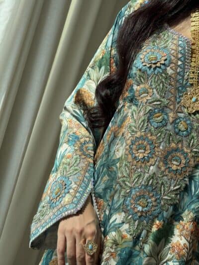 Elegant embroidered floral traditional dress showcasing intricate beadwork and vibrant colors.