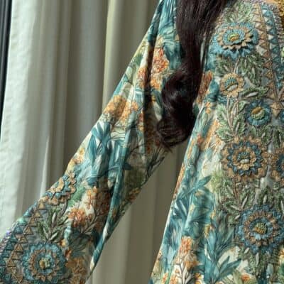 Elegant embroidered floral dress showcasing intricate embroidery and vibrant colors for traditional and fashionable occasions.
