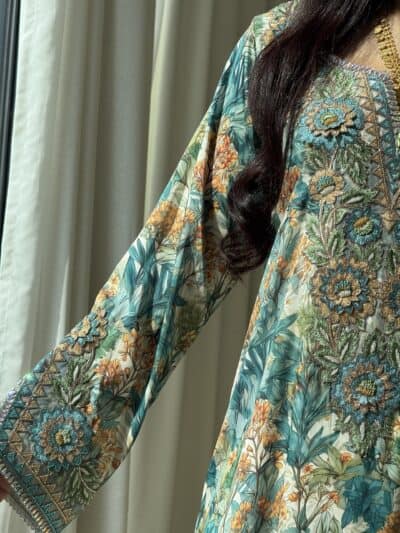 Elegant embroidered floral dress showcasing intricate embroidery and vibrant colors for traditional and fashionable occasions.