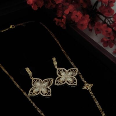 Elegant gold butterfly jewelry set with diamond accents for women.