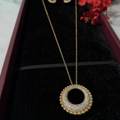 Elegant gold pendant necklace with sparkling diamonds from Taj Almaha jewelry collection.