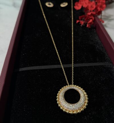 Elegant gold pendant necklace with sparkling diamonds from Taj Almaha jewelry collection.