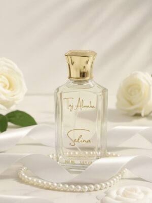 Luxurious Taj Almaha Selina perfume bottle with elegant gold cap, surrounded by white roses and pearls, epitomizing sophistication.
